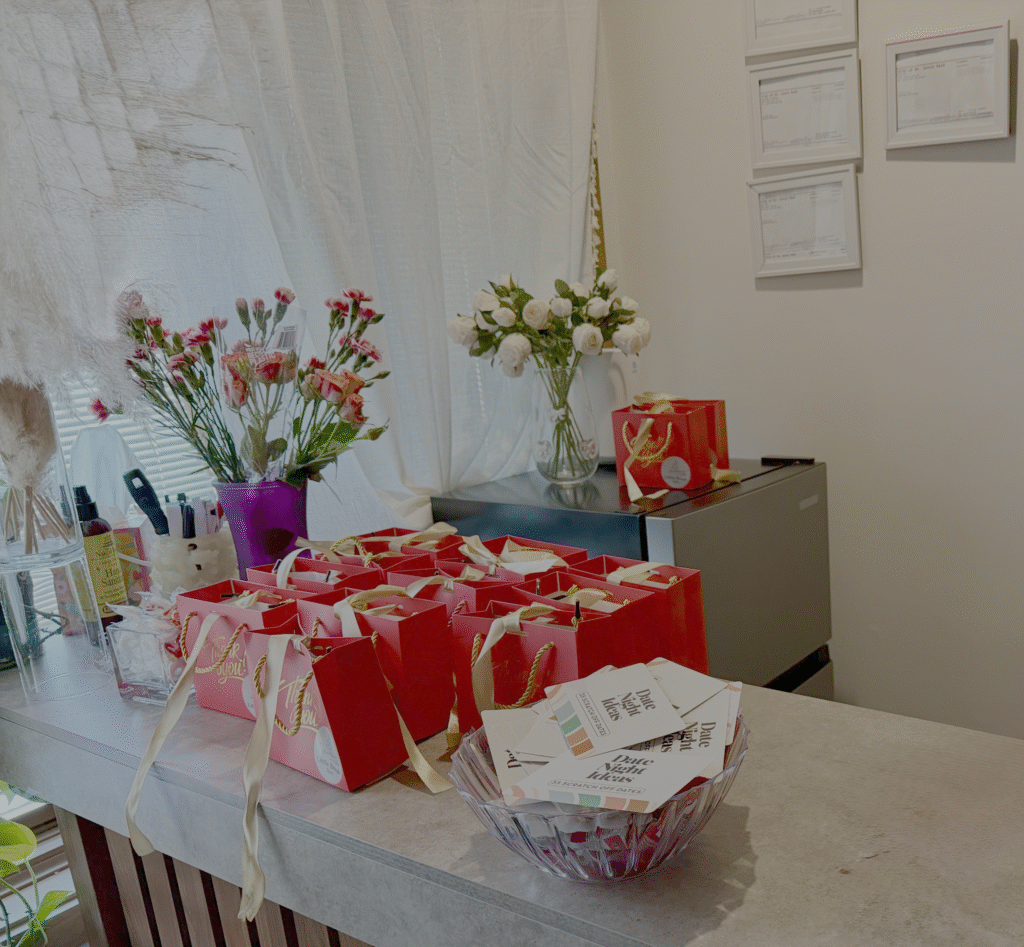 Valentine’s gift bags and floral arrangements at Little Break Spa seasonal celebration.